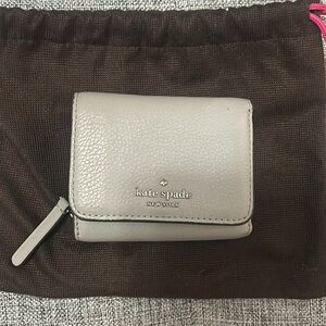Kate Spade Small Grey Leather Wallet comes with brown fabric pouch